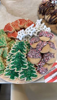 a plate full of cookies and christmas trees