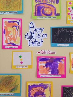 children's artwork is displayed on the wall in front of their classroom name tags