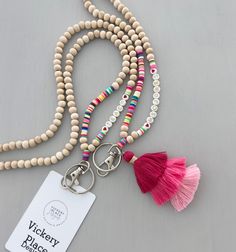 "PINK RAINBOW ~ Stylish, super chic lanyard featuring natural wood beads, accented with rainbow heishi beads, letter beads and a fluffy three tier tassel (select style when ordering), strung on strong bead wire with a swivel clasp hook. Lightweight, so comfortable and easy to wear. Fashionable way to hold keys or ID/badges. Great gift idea ~ You won't find this unique, original lanyard anywhere else:) original list date: 5/9/22 PERSONALIZE ~ with your name OR word(s) ~ select style 1 or 2. If yo List Date, Bead Wire, Lanyard Necklace, Beaded Lanyard, Teacher Lanyard, Native Beadwork, Lanyard Keychain, Teacher Things, Beaded Lanyards