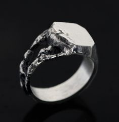 Handmade Brutalist Ring with Cracked and Textured Design This handcrafted brutalist ring combines rugged artistry with modern elegance. Designed for those who appreciate unique, handcrafted jewelry, this piece stands out with its distinct cracked and textured surface. Key Features: Artistic Design: Inspired by brutalist architecture, the ring features a cracked, textured finish that adds a bold statement to any look. Quality Materials: Made from premium silver, this ring offers both durability a Brutalist Sterling Silver Signet Ring, Brutalist Ring, Brutalist Jewelry, Silver Statement Jewelry, Angel Ring, Brutalist Architecture, Art Brut, Jewelry For Men, Textured Design