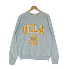 PLEASE ASK ANY QUESTION BEFORE BUYING THIS IS USED CLOTHING PLEASE DONT EXPECTED IT TO BE LIKE NEW OR IN PRISTINE CONDITION 80s UNIVERSITY OF CALIFORNIA CREWNECK SWEATSHIRT tag Tultex material Cotton 50% Polyester 50% saiz on tag M (Medium) Mesasures About ( Approximately) -Armpit to Ampit : 21.5 inch -Length (back collar down) : 25 inch Condition : used good condition 7.5/10 ** No Tears And No Hole** **Has a yellow stains see a picture detail** 🎈PLEASE READ THE DESCRIPTION AND POLICY BEFORE BU Ucla Sweatshirt, California Crewneck, Ucla University, Ucla Bruins, University Sweatshirts, Collared Sweatshirt, Zippered Sweater, Vintage Adidas, Sweater Design