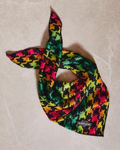 a multicolored scarf laying on the floor