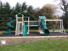 a playground with a slide and climbing frame