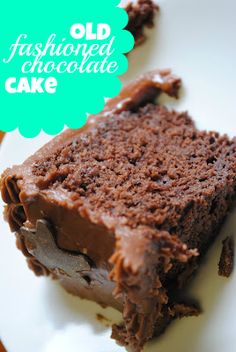 a piece of chocolate cake on a white plate with a green speech bubble above it