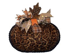 an animal print pumpkin with bows on it