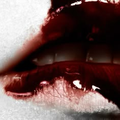 a woman's mouth with blood on it