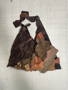 All in leather: body of the bag in dark brown split suede, patchwork created with many leathers, each different in texture and colour. I look at it and think of my mountains which I willingly reach whenever I can, I fill my eyes with all those wonderful trees that change color with every season. I love the mountain landscape and the pleasantly slow pace that only those who live in those places know, the scent of the wood coming out of the chimneys of the houses, the silence. The trees before the Rustic Brown Bags With Leather Handles, Bohemian Multicolor Bags For Fall, Bohemian Brown Bags For Fall, Bohemian Multicolor Fall Bags, Bohemian Satchel Bag For Fall, Bohemian Brown Shoulder Bag For Fall, Handmade Brown Bags For Festival, Brown Patchwork Hobo Bag, Brown Patchwork Hobo Bag For Daily Use