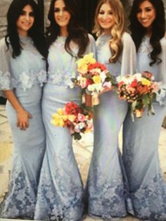 the bridesmaids are posing for a photo in their blue dresses and bouquets