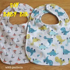 two bibs with different designs on them sitting on a table next to the words diy baby bib