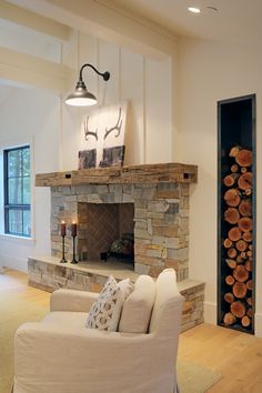 a living room filled with furniture and a fire place