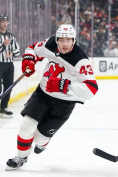 a hockey player is running on the ice