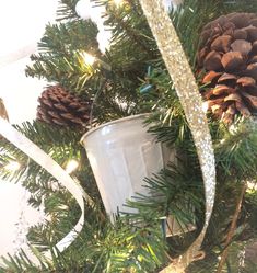 a christmas tree with pine cones and other decorations