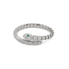 BVLGARI Serpenti Bracelet in White Gold with Diamonds and Emeralds Glorifying the eyes of the snake and their magnetic power of attraction, the Serpenti bracelet sparkles with mesmerizing sensuality. Sophisticated and glamorous, the jewel coils around the wrist, striking with the precious beauty of scales and with the distinctive sinuosity of the snake. The intensity of the serpent’s gaze is celebrated with one of Bulgari’s trademark signatures: two simply irresistible hypnotizing colored gemstones. Details 18k White Gold4.21ct Diamond 0.26ct Emeralds Ref 356903 Size: Medium (17cm) Condition: Brand New *Comes with original box & authenticity card Bvlgari Bracelet Serpent, Emerald And Diamond Bracelet, Bvlgari Serpenti Bracelet, Bulgari Bracelet, Power Of Attraction, White Gold Diamond Bracelet