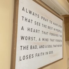 a sign on the wall that says, always pray to have eyes that see best in people