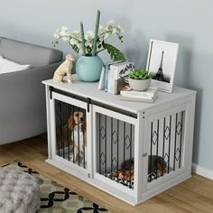 a living room with a couch, coffee table and dog in the cage on it