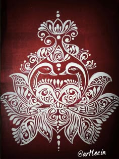 an intricately designed design on a red background with white ink in the shape of a flower