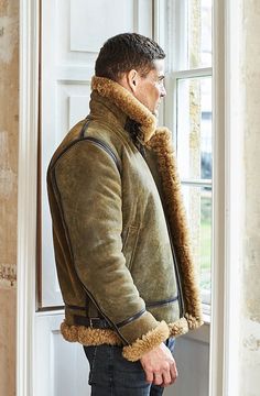 Handcrafted in Somerset, England, this traditional sheepskin WWII aviator jacket has been modernized with chunky zippers and glorious tactile shearlings. Features leather covered seams, two front pockets, an asymmetrical internal wind flap to keep you insulated, toning leather binding, adjustable straps on the hem and collar, YKK durable zippers and easy access handwarmer welt pockets. The expert design nods cleverly to classic styles, but uses a modern fit, flexible tactile Hurricane Sheepskin Flying Jacket, Leather Binding, Somerset England, Aviator Jacket, Garment Cover, Sheepskin Jacket, Grey Flannel, Sheepskin Coat, Aviator Jackets