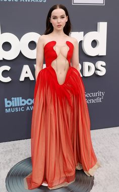 an image of a woman in a red dress at the billboard music awards on stage