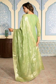 Light green tissue kurta featuring with sequins and mirror work on placket and all-over floral woven motifs. Comes with heavy Banarasi bordered dupatta and matching pant. - Aza Fashions Green Slub Silk Salwar Kameez With Mirror Work, Green Salwar Kameez With Mirror Work In Slub Silk, Green Slub Silk Dupatta With Mirror Work, Green Cotton Silk Churidar With Gota Work, Green Slub Silk Churidar For Transitional Season, Transitional Green Slub Silk Churidar, Pista Green Tissue Silk Kurta For Diwali, Green Tissue Silk Kurta With Zari Work, Green Traditional Wear With Gota Work In Tissue Silk