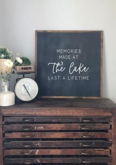 a blackboard with the words memories made at the lake last a life time on it