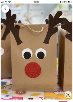 two brown bags with reindeer noses on them