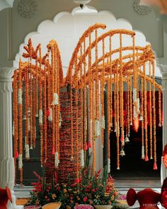 an elaborately decorated room with orange and white decorations