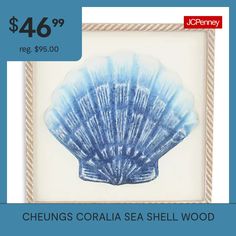 a blue sea shell in a frame with the words cheungs coral sea shell wood $ 46 99