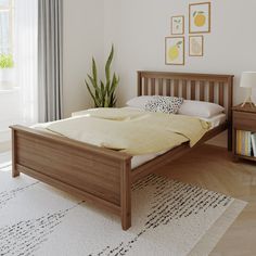 a bedroom with a bed, nightstands and potted plant in the corner next to it