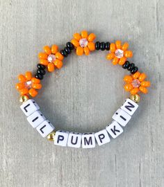 Lil Pumpkin Flower Bracelet 🎃 Perfect little Halloween gift for your lil ghoul 👻 She will love it 🧡 Made with seed beads, bicone beads and 18k gold filled beads ✨✨ CARING TIPS FOR YOUR JEWELRY ⭐️Treat and store with care. ⭐️ For longevity, avoid exposing your jewelry to water. ⭐️ Avoid having direct contact with lotions, perfumes, sanitizers as these chemicals may cause discoloration of your jewelry. Bead Pumpkin, Pumpkin Bracelet, Stacked Beaded Bracelets, Holiday Bracelets, Halloween Bracelet, Halloween Flowers, Pumpkin Flower, Halloween Beads, Bracelet Ideas