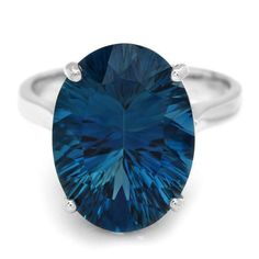 a blue ring with an oval cut stone