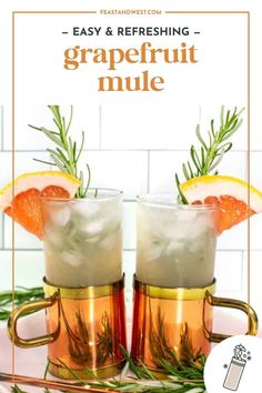 two glasses filled with grapefruit mules and garnished with rosemary