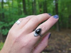 "Mystically gorgeous black Spinel gemstone & darkened silver ring featuring a mystical bat. Mesmerizing iridescence. Witchy, unique mystic style.  Truly magical stone.  Comfortable everyday wear. Made to last. Before purchasing the ring of your dreams, keep in mind that everything is 100% designed and handcrafted by Christina Zefis. Not one piece is 100% alike! Gemstones are unique, and so is the creative process! M A T E R I A L S  ❂ Black Spinel trillion shape faceted gemstone (approximately 13x9mm) ❂ Sterling silver half round textured band (3mm) ❂ Made by hands, with love!  P R O P E R T I E S ♦ SPINEL  Revitalization Inspiration New Hope Victory Re-Energizing All Levels of the Self  Wear Spinel to lend energy to the body. A Major use of the stone is also to attract wealth and prosperi Mystical Black Sterling Silver Rings, Mystic Style, Bat Ring, Chakra Racine, Magical Stones, Spinel Gemstone, Emotional Body, Black Spinel, Faceted Gemstones