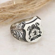 "Coat of Arms Signet Ring, Family Crest Rings, Crest Ring, Family Rings, Family Crest Signet Ring, Custom Signet Ring, Personalized Jewelry ❥ Family Ring symbolize the glory and honor of our ancestors. We manufacture your family crest rings using high technology with diligence so that you can pass them on to next generation. Oval Celtic Design Raised Family Ring are physical manifestations of Family, Country, Culture and Tradition. Be proud of your family crest, honor your ancestors and pass you Engraved Sterling Silver Open Ring, Sterling Silver Open Ring Jewelry Engraved, Classic Silver Signet Ring For Promise, Unique Formal Engraved Sterling Silver Ring, Formal Heirloom Engraved Sterling Silver Ring, Unique Formal Sterling Silver Engraved Ring, Elegant Sterling Silver Signet Promise Ring, Unique Sterling Silver Engraved Ring For Formal Occasions, Unique Oval Engraved Ring With Polished Finish