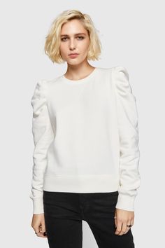 Our best-selling Janine Sweatshirt has a subtle feminine feel thanks to its low-key statement ruffled sleeves. We love wearing this casual-cool top with everything from jeans to leather skirts. | Rebecca Minkoff Janine Sweatshirt In White - Size XS Casual Cotton Puff Sleeve Top With Ruffle, Casual Fall Puff Sleeve Tops, Casual Puff Sleeve Tops For Fall Gatherings, Relaxed Fit Blouson Sleeves Tops For Fall, Trendy Fall Tops With Blouson Sleeves, Trendy Blouson Sleeve Tops For Fall, Chic Puff Sleeve Top For Casual Gatherings, Trendy Tops With Blouson Sleeves For Fall, White Ruffle Sleeve Top For Fall