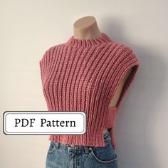 a mannequin wearing a pink knitted sweater