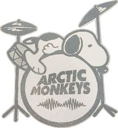 an arctic monkeys sticker on the side of a white drum with a drummer's head