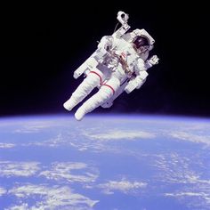 an astronaut floating in the air above the earth with text reading, good morning everyone have a great idea today