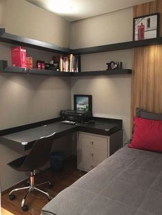 a bedroom with a bed, desk and shelves