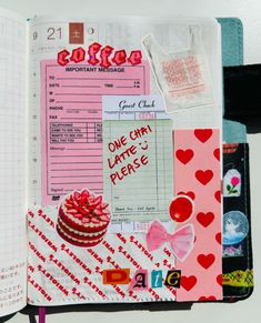 an open notebook with lots of papers and stickers on the pages, including a cake