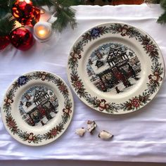 two plates on a table with christmas decorations