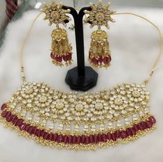 a necklace and earring set on display