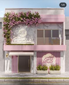 a pink and white building with plants growing on it