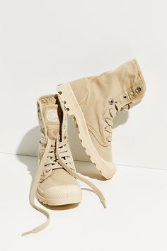 An update to Palladium's iconic sneaker and boot hybrid, this canvas shoe is featured in a baggy high-top design that can be worn folded down for a casual look.* Side logo patch* Lace-up front* Lugged sole Baggy Boots, Style With Leggings, Ankle Boots With Leggings, Celine Boots, Saint Laurent Boots, Boots Outfit Ankle, Chic Outerwear, Stylish Leggings, Canvas Shoe