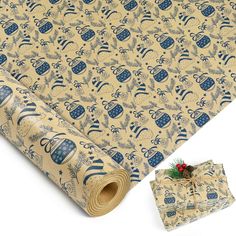 christmas wrapping paper and gift wrapper on top of a white background with blue ornaments