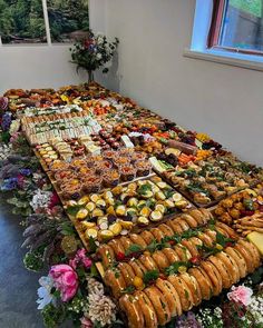 a long table filled with lots of different types of food