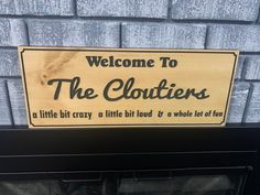 a sign that says welcome to the clottiers on it's front door