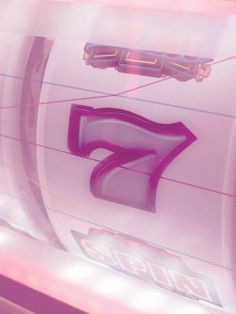 the number seven is displayed in front of a pink background