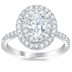 a white gold ring with an oval cut diamond surrounded by round diamonds