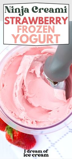 a bowl filled with ice cream next to strawberries