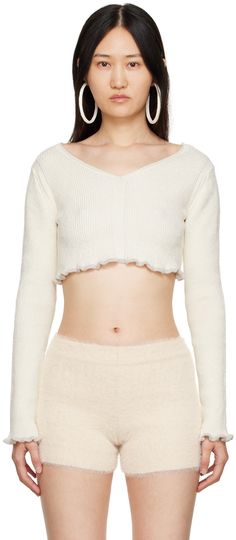 Rib knit stretch linen and nylon-blend sweater. · V-neck · Lettuce edge at cropped hem and cuffs Supplier color: Off-white White Fitted V-neck Cropped Sweater, Spring Cropped Cream Sweater, Spring Cream Cropped Sweater, Cropped Sweater For Spring Loungewear, Fitted White Cropped Sweater With Ribbed Cuffs, White V-neck Cropped Sweater For Spring, Spring White V-neck Cropped Sweater, Fitted Cropped Sweater With Ribbed Cuffs, Stretch Cropped V-neck Sweater For Spring